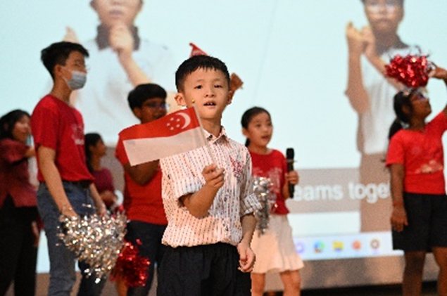 Co-leading the National Day sing-along.