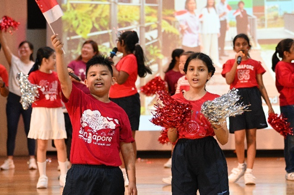 Leading our school during the National Day sing-along. Are you ready? I can't hear you!